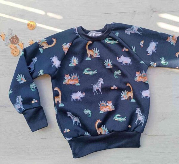 Sudadera artesanal de animales que crece con los niños hecha a mano por la sombra del gato