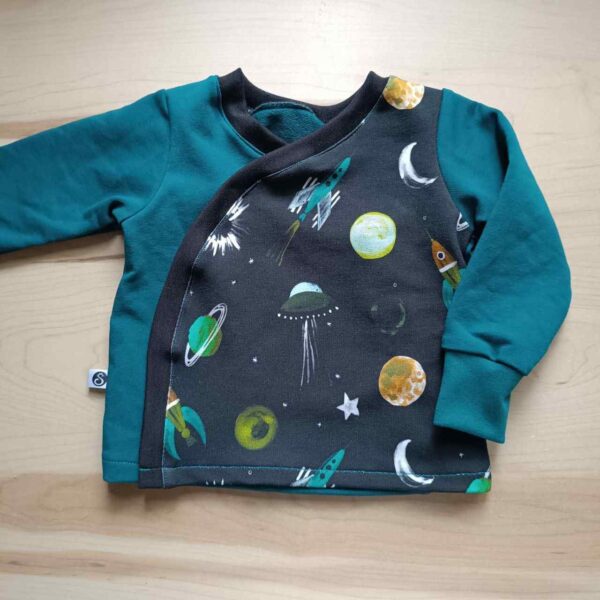 Chaqueta cruzada del espacio para bebés hecha por la sombra del gato
