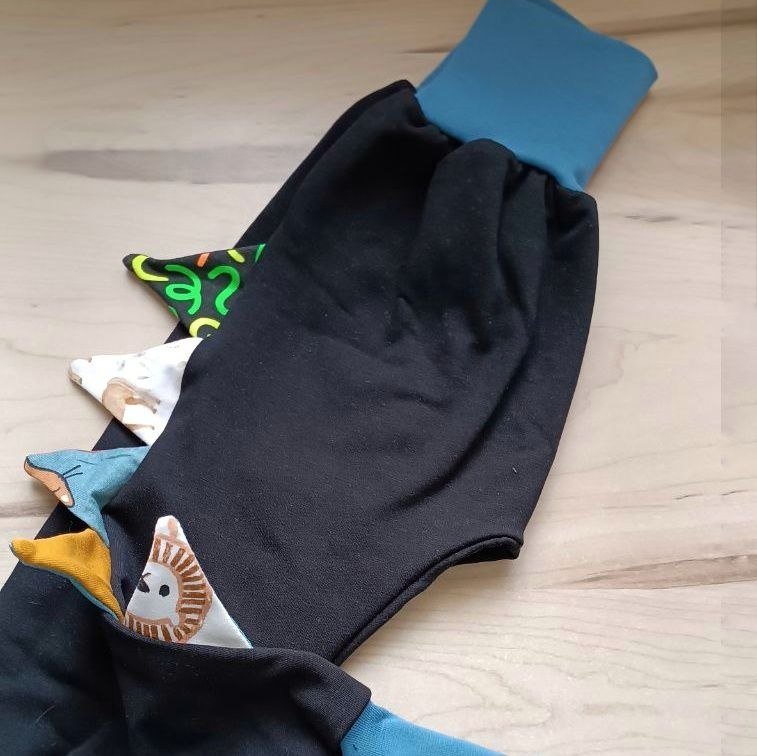 Pantalones evolutivos personalizables con escamas de dragón de La sombra Del Gato